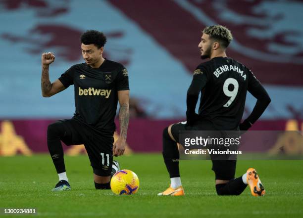 Jesse Lingard and Said Benrahma of West Ham United take a knee to respect the Black Lives Matter anti racist campaign before the Premier League match...