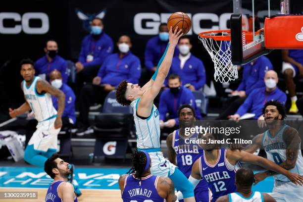 LaMelo Ball of the Charlotte Hornets dunks the ball during the fourth quarter of their game against the Philadelphia 76ers at Spectrum Center on...