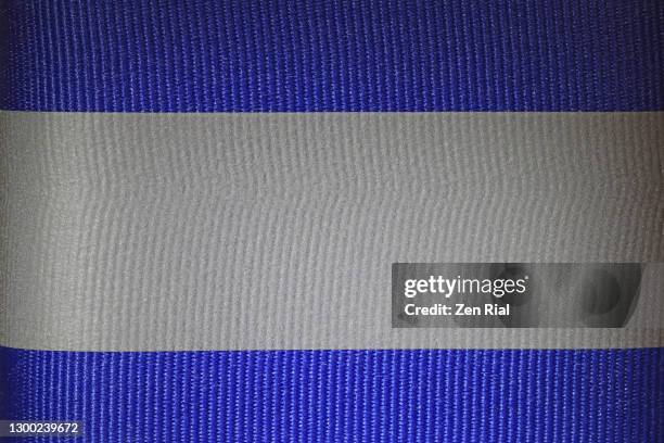 close-up of blue and gray adhesive reflective tape in full frame - reflector stock pictures, royalty-free photos & images
