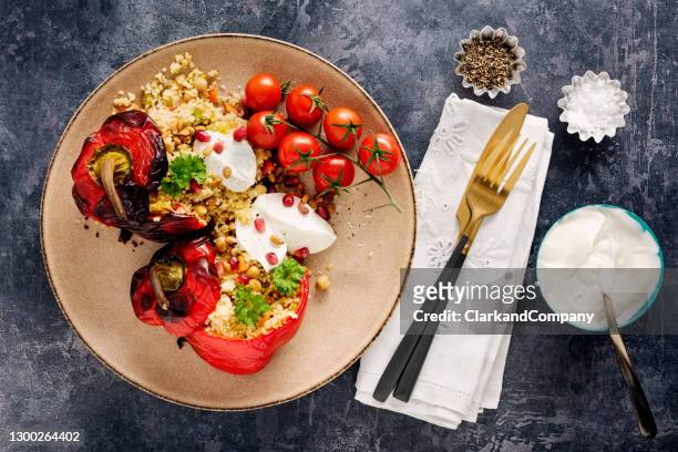 roasted and stuffed  peppers with couscous and yoghurt - roasted pepper stock pictures, royalty-free photos & images