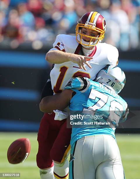 John Beck of the Washington Redskins is sacked by Greg Hardy of the Carolina Panthers during their game at Bank of America Stadium on October 23,...