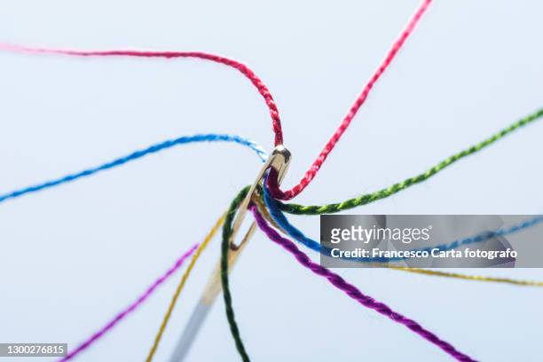 needle of sewing and colored threads - sewing needle stock pictures, royalty-free photos & images