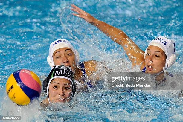 Cecilia Canetti and Mariana Zablith of Brazil, is challenged against Sarah Orozco of Mexico, in the Women's Water Polo during the Pan American Games...