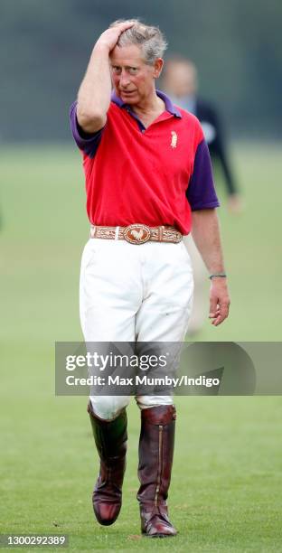 Prince Charles, Prince of Wales walks to the prize giving after playing, for team Highgrove, in the GCC Polo Cup polo match at Guards Polo Club,...