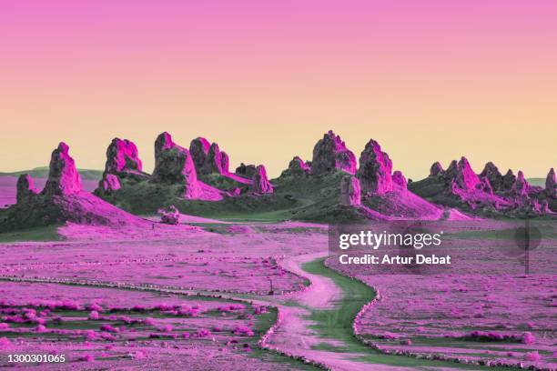 dreamy picture of colorful rock formations in california with saturated colors. - surreal landscape stockfoto's en -beelden