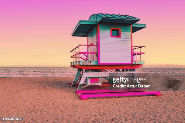 dreamlike picture of colorful lifeguard cabin in the miami beach at sunset. - miami stock pictures, royalty-free photos & images