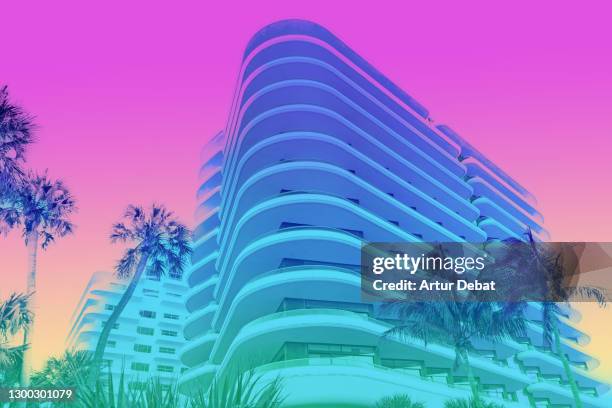 dreamlike picture of colorful building with palm trees in miami beach. - saturated color stock pictures, royalty-free photos & images