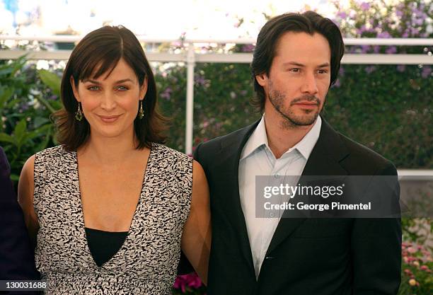 Carrie-Anne Moss and Keanu Reeves during 2003 Cannes Film Festival - "Matrix Reloaded" Photo Call at Palais des Festivals in Cannes, France.