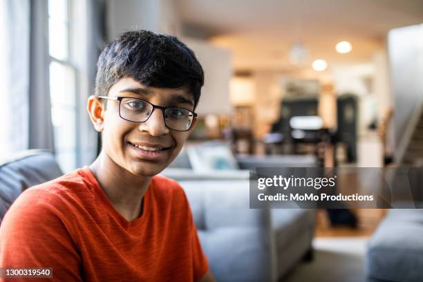 portrait of teenage boy at home - boy indian foto e immagini stock