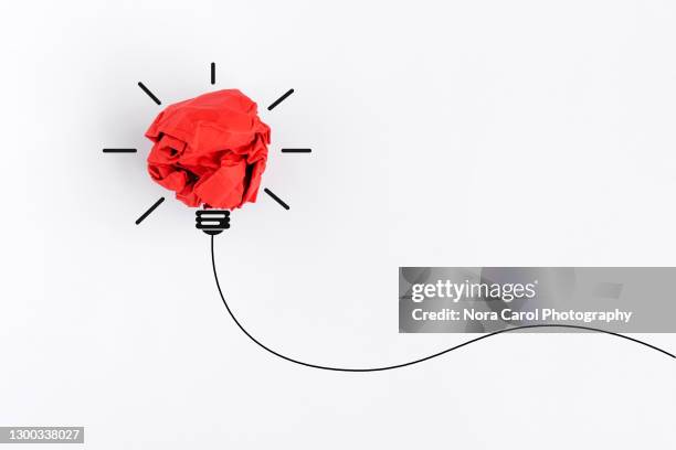 light bulb crumpled paper ball on white background with copy space - business drawing white background stock pictures, royalty-free photos & images