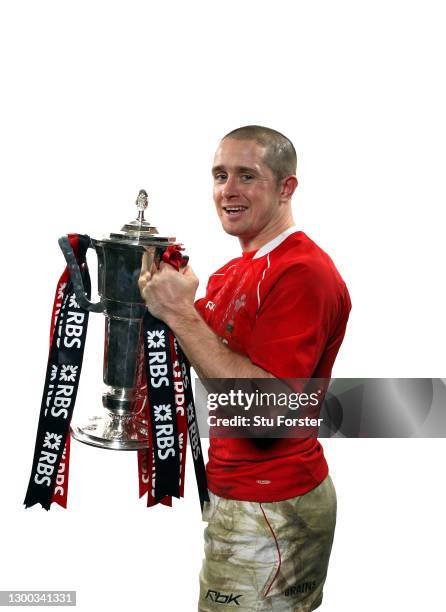 Wales wing Shane Williams celebrates with the Six Nations Trophy after the RBS Six Nations Championship match between Wales and France at the...