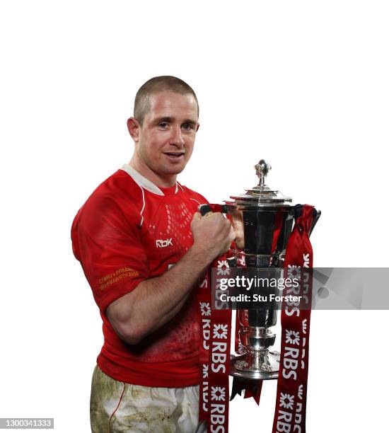 Wales wing Shane Williams celebrates with the Six Nations Trophy after the RBS Six Nations Championship match between Wales and France at the...