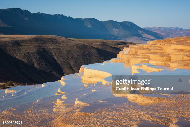 early morning colors on the sedimentary rocks terraces of badab-e surt in the alborz mountains, badab soort, elbrouz, mazandaran province, northern iran - pamukkale stock pictures, royalty-free photos & images