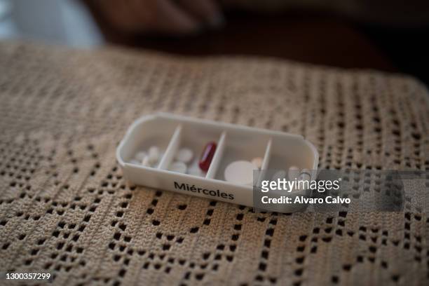 Picture of Paula Fernandez's pillbox, with 14 pills she takes daily in the morning, on November 4, 2020 in Tamarite de Litera, Spain. Paula is a...