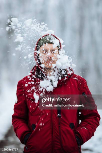 nobody likes getting hit by a snowball - snowball hit stock pictures, royalty-free photos & images