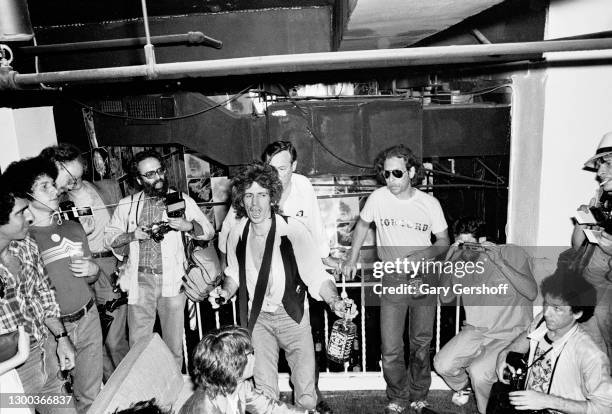 British Rock musician Keith Richards , of the group the Rolling Stones, holds a bottle of whiskey, as he speaks during the group's 'Emotional Rescue'...