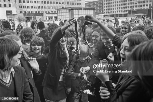 Schoolchildren burning their ties in a protest strike at County Hall in London, organised by the Schools Action Union , UK, 10th May 1972.