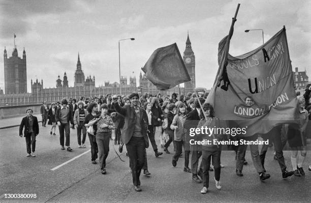 Schoolchildren marching across Westminster Bridge for a protest strike at County Hall in London, organised by the Schools Action Union , UK, 10th May...