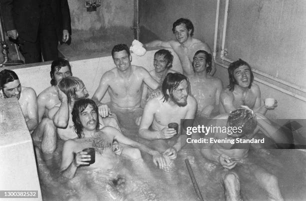 Players of Birmingham City FC in a communal bath after the team was promoted to the First Division following their 1-0 victory over Leyton Orient,...