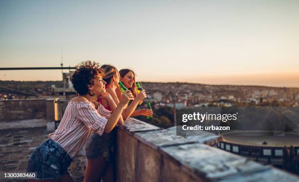 rooftop party - balcony party stock pictures, royalty-free photos & images