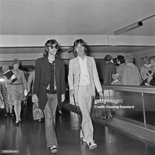 English musician Keith Richards and singer Mick Jagger of the Rolling Stones at Heathrow Airport in London, UK, 26th May 1972.