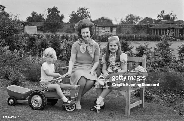 Raine, Lady Dartmouth , the wife of the 9th Earl of Dartmouth, with her youngest children Lady Charlotte Legge and the Honourable Henry Legge, UK,...