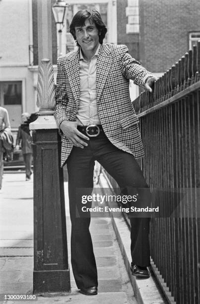 Romanian tennis player Ilie Nastase in a checked jacket, UK, 12th July 1972.