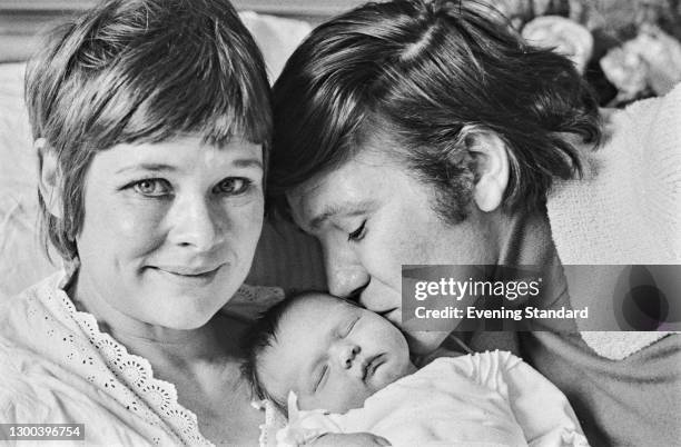 British actress Judi Dench with her husband, actor Michael Williams and their baby daughter Finty Williams , UK, 27th September 1972.