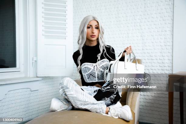 transgender man feminine millennial portrait lgbtqi real people - white purse stock pictures, royalty-free photos & images