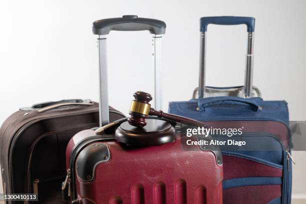 judge's gavel on a travel suitcase. refund of the amount of the plane ticket canceled by judicial way. - jumbo hostel stock pictures, royalty-free photos & images