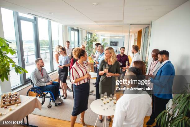 diverse businesspeople at new business launch party - office party stock pictures, royalty-free photos & images