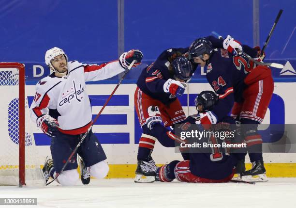 Artemi Panarin, Ryan Strome and Kaapo Kakko of the New York Rangers celebrates Strome's goal at 7:55 of the third period against Trevor van Riemsdyk...