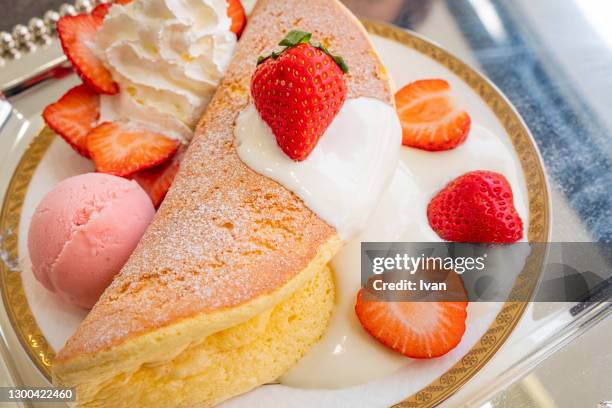 japanese souffle pancake with strawberry and milk cheese sauce - souffle stock pictures, royalty-free photos & images
