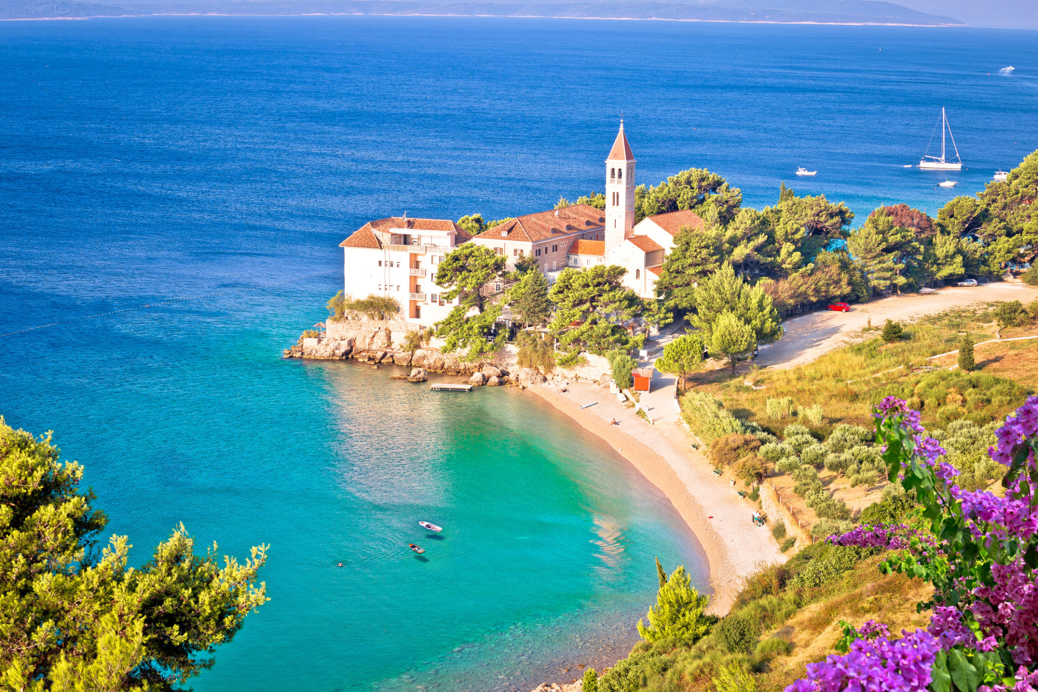 Bol on Brac island. Monastery on pebble beach in Bol view Bol on Brac island. Monastery on pebble beach in Bol view