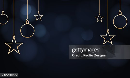 Hanging golden starts and balls on dark background Hanging golden starts and balls on dark background