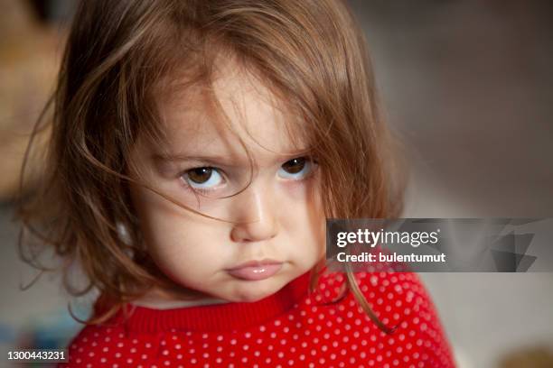 portrait of 2.5 years old baby girl angry - angry babies stock pictures, royalty-free photos & images