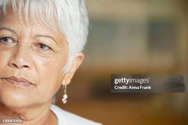 beautiful senior woman in deep thought - gray hair stress stock pictures, royalty-free photos & images