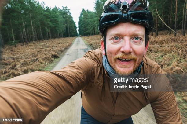 happy cyclist taking selfie on forest track - bicycle trail outdoor sports stock pictures, royalty-free photos & images