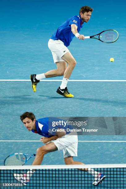 Nicolas Mahut and Edouard Roger-Vasselin of France play in their group C doubles match against Philipp Oswald and Tristan-Samuel Weissborn of Austria...