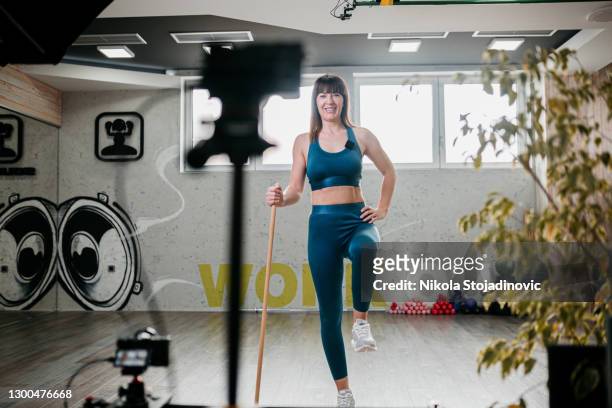 young woman at training in front of camera - in front of camera stock pictures, royalty-free photos & images