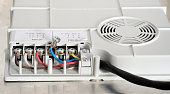 Electrical connection of the induction panel cooker, contacts, electricity. Pofessional wiring and installation hob in the kitchen