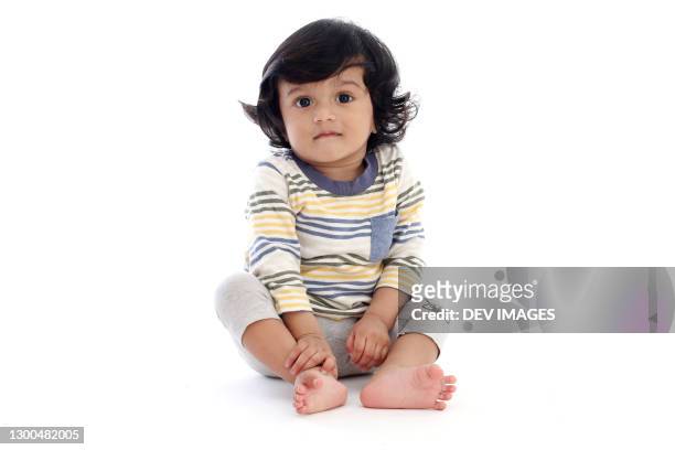 adorable baby boy against white background - boy indian foto e immagini stock