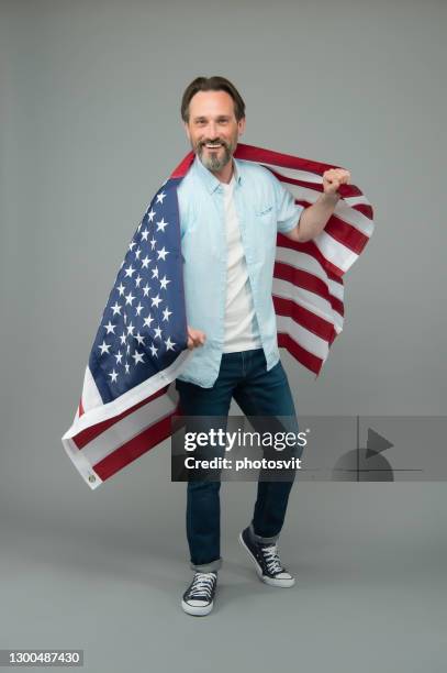 Immigration to USA. Mature man hold US flag. Visa for immigration travel. American green card. United States permanent residency. Citizenship and immigration. Immigration and naturalization service