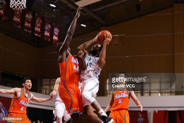 Dez Wells of Jiangsu Dragons goes to the basket against Andrew Nicholson of Fujian Sturgeons during 2020/2021 Chinese Basketball Association League...