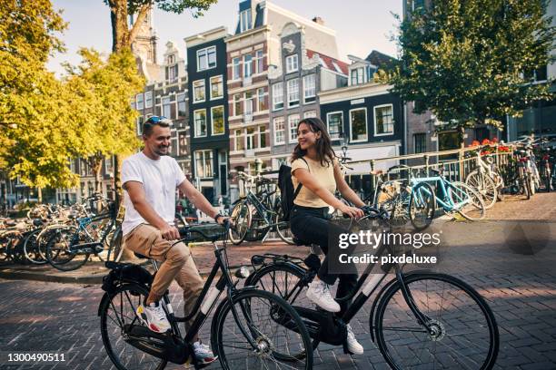 i'd travel a thousand cities to get to you - amsterdam stock pictures, royalty-free photos & images