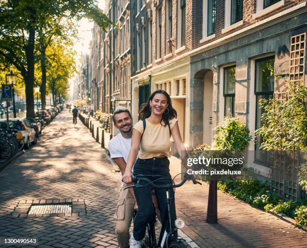 netherlands, here we come! - happy young couple stock pictures, royalty-free photos & images