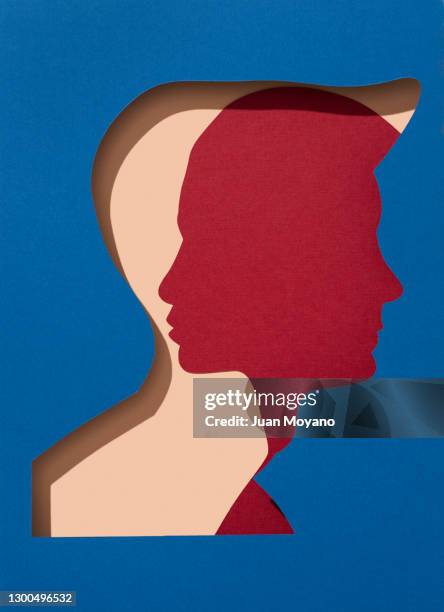 man and woman silhouettes - gender equality stockfoto's en -beelden