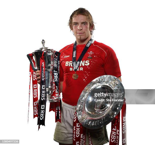 Wales player Alun Wyn Jones pictured with the Triple Crown and the 6 Nations Trophy after the RBS Six Nations Championship match between Wales and...