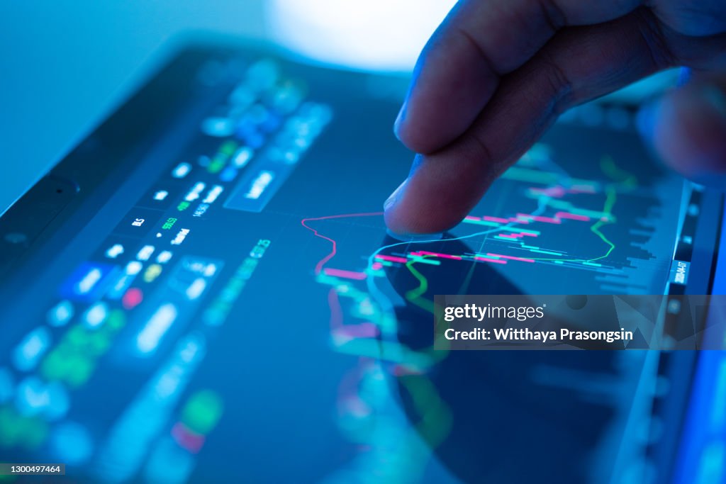 Businessman checking stock market data