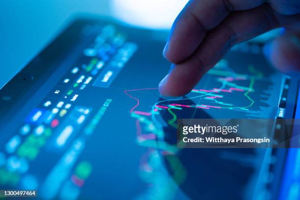 businessman checking stock market data - gestion de dinero fotografías e imágenes de stock